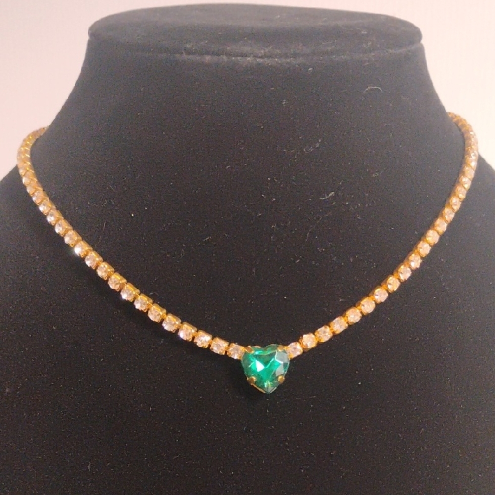 Tennis Necklace with a heart-shaped emerald or green-colored stone
